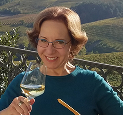 Deborah Grossman drinking wine Italy